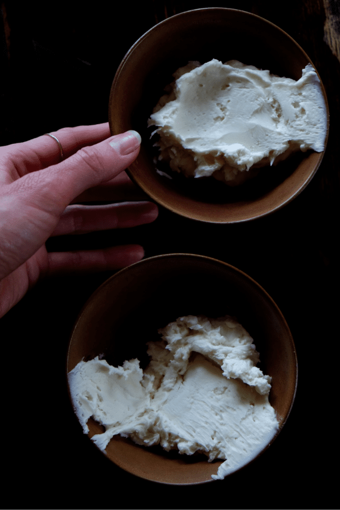 hand and bowls of body butter